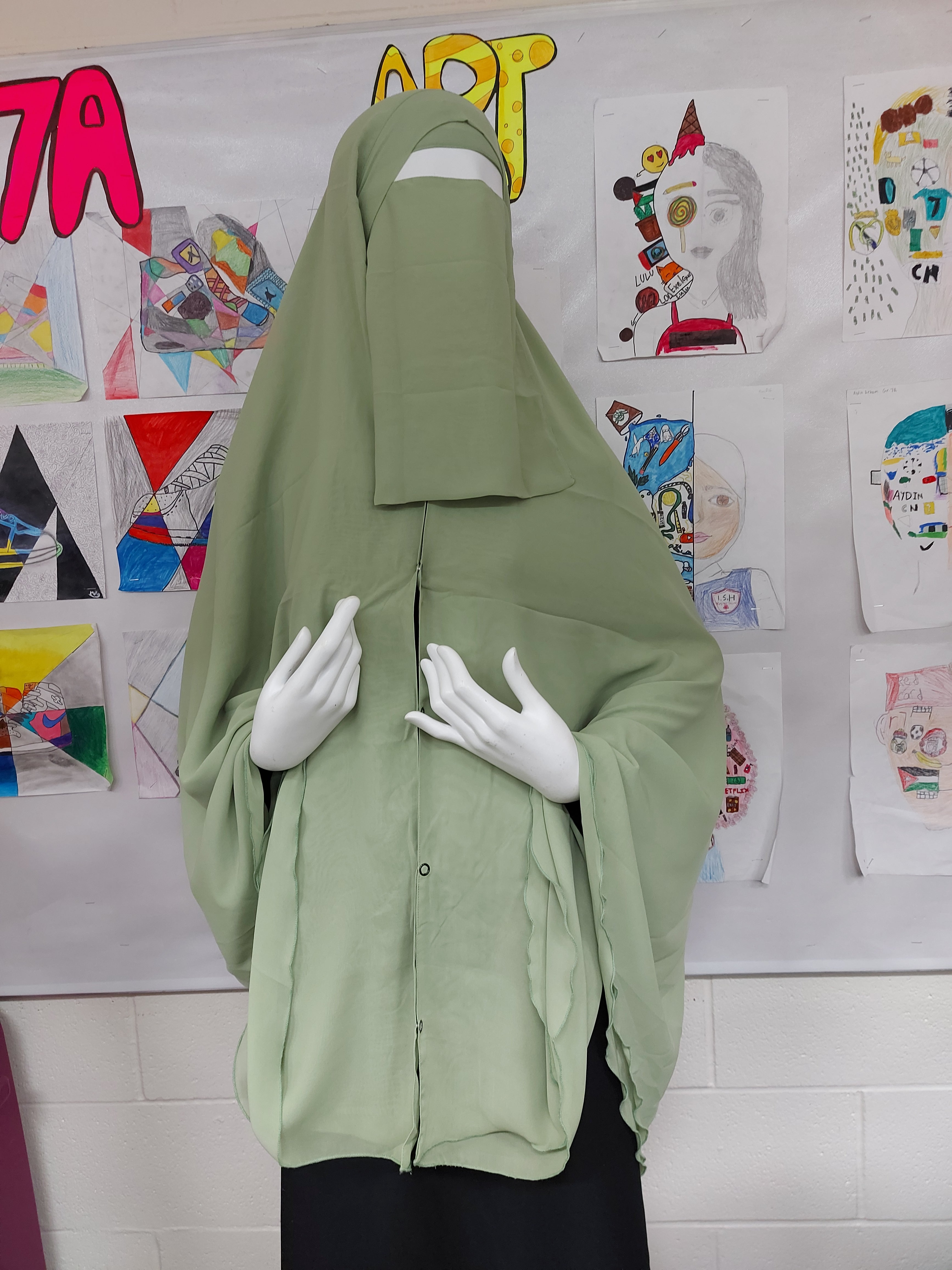 Premium chiffon double-layered buttoned jilbab with back tie & matching niqab in light green color by Niqabik